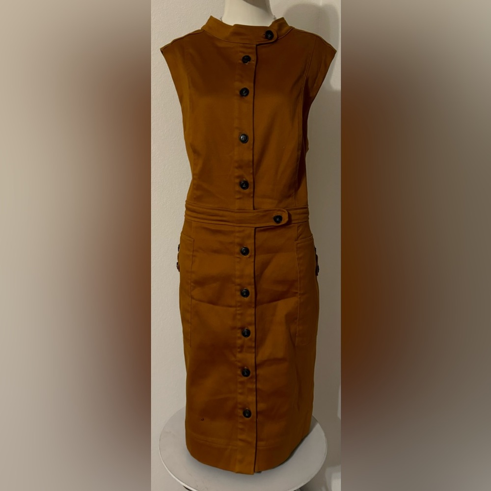Super cute dress with pockets.  Great color